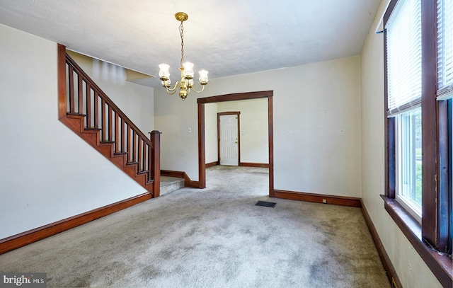 625 Hunter St, Gloucester City, NJ 08030 - carpeted spare room featuring a chandelier, stairs, and baseboards