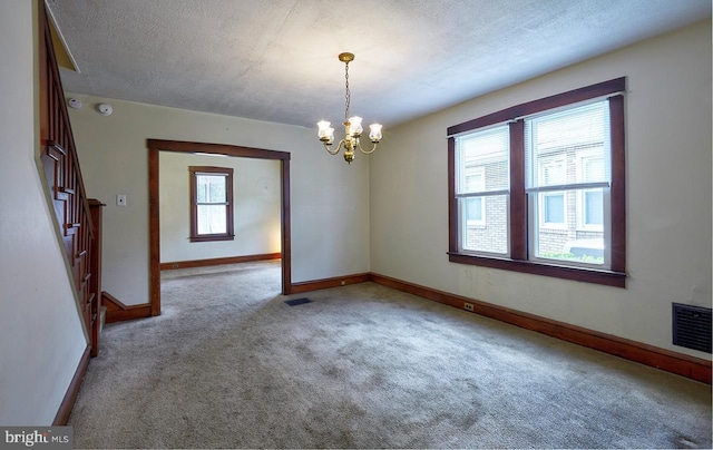 625 Hunter St, Gloucester City, NJ 08030 - spare room featuring carpet flooring, a chandelier, baseboards, a textured ceiling, and stairs