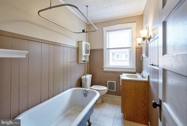 625 Hunter St, Gloucester City, NJ 08030 - full bath with a freestanding tub, toilet, tile patterned flooring, vanity, and a wainscoted wall