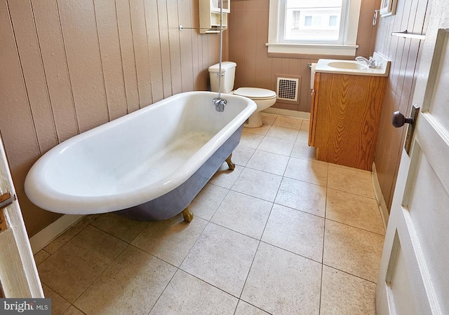 625 Hunter St, Gloucester City, NJ 08030 - full bath with toilet, a freestanding tub, tile patterned floors, vanity, and baseboards