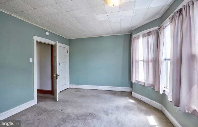 625 Hunter St, Gloucester City, NJ 08030 - carpeted spare room with baseboards and ornamental molding