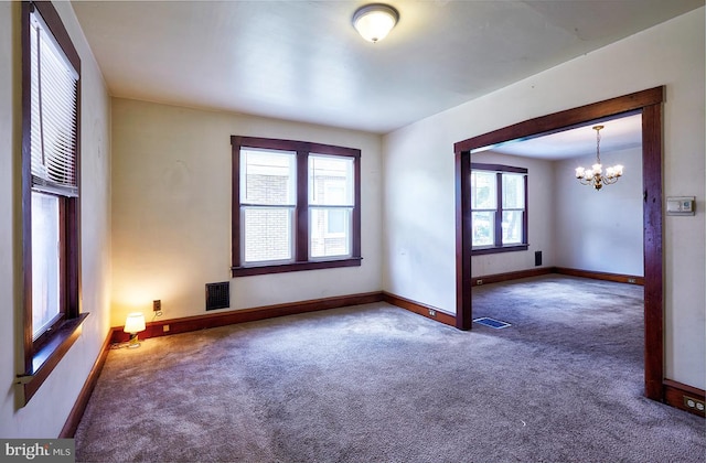 625 Hunter St, Gloucester City, NJ 08030 - carpeted empty room with a chandelier and baseboards