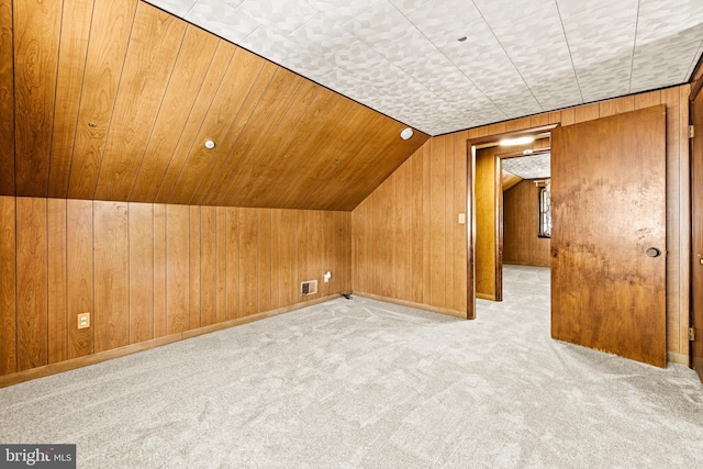 2521 Moore Ave, Baltimore, MD 21234 - additional living space with carpet, wooden walls, and lofted ceiling