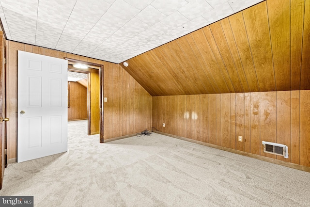 2521 Moore Ave, Baltimore, MD 21234 - additional living space with wood walls, carpet floors, and vaulted ceiling