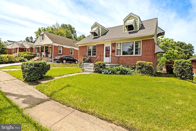 2521 Moore Ave, Baltimore, MD 21234 - cape cod house featuring brick siding, a front lawn, and roof with shingles