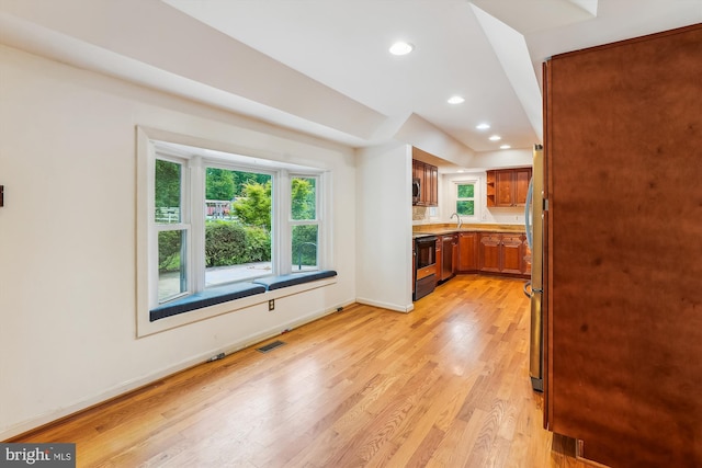 46 Misty Ln, Stafford, VA 22556 - kitchen featuring brown cabinets, light wood-style flooring, recessed lighting, baseboards, and light countertops