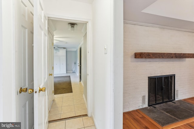 46 Misty Ln, Stafford, VA 22556 - corridor with brick wall, light tile patterned flooring, and baseboards