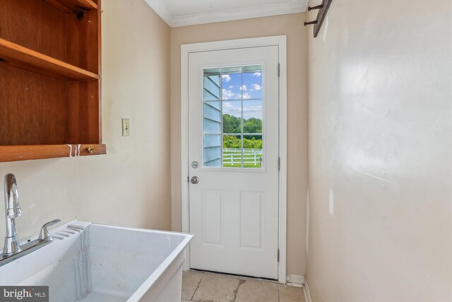 46 Misty Ln, Stafford, VA 22556 - doorway to outside with light tile patterned floors, ornamental molding, baseboards, and a sink
