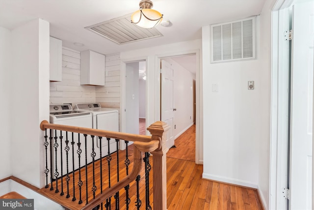 46 Misty Ln, Stafford, VA 22556 - hall featuring separate washer and dryer, light wood-style floors, baseboards, and an upstairs landing
