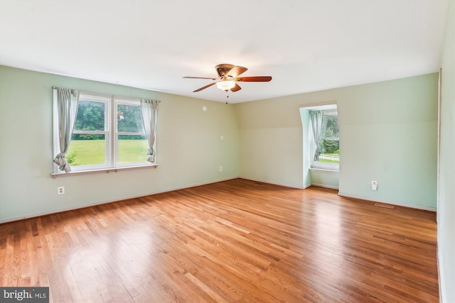 46 Misty Ln, Stafford, VA 22556 - unfurnished room with plenty of natural light, a ceiling fan, light wood-type flooring, and baseboards