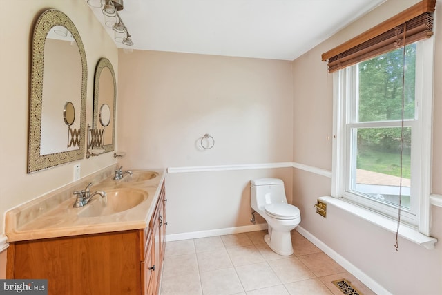 46 Misty Ln, Stafford, VA 22556 - bathroom with double vanity, healthy amount of natural light, baseboards, and tile patterned floors