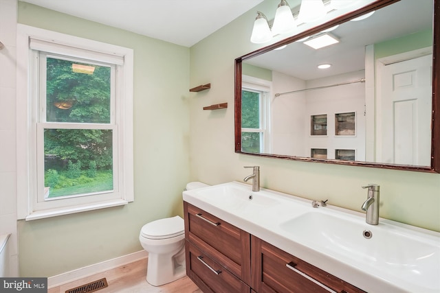 46 Misty Ln, Stafford, VA 22556 - bathroom with healthy amount of natural light, double vanity, baseboards, and toilet