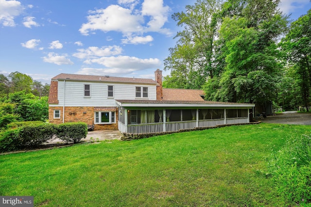 46 Misty Ln, Stafford, VA 22556 - back of property featuring a sunroom, a chimney, and a lawn