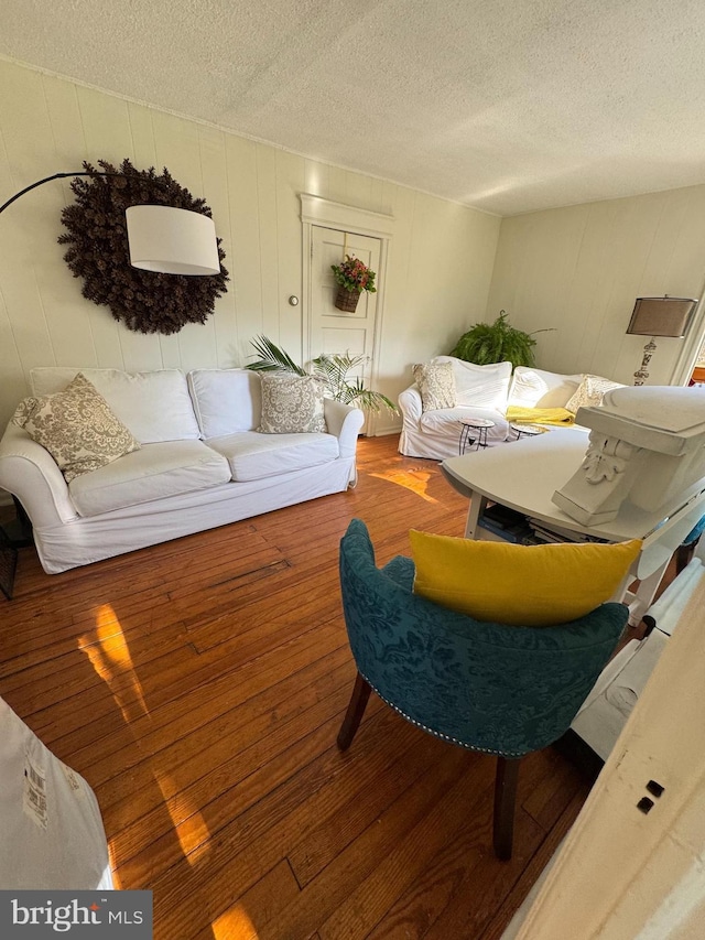73 Fairfield Ave, Lawrence, NJ 08648 - living room featuring a textured ceiling and wood finished floors