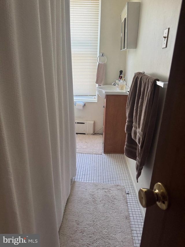 73 Fairfield Ave, Lawrence, NJ 08648 - full bathroom with vanity, a baseboard radiator, and tile patterned flooring