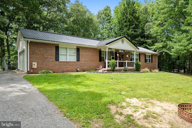27073 Carrie Ct, Mechanicsville, MD 20659 - ranch-style house featuring covered porch, brick siding, and a front lawn