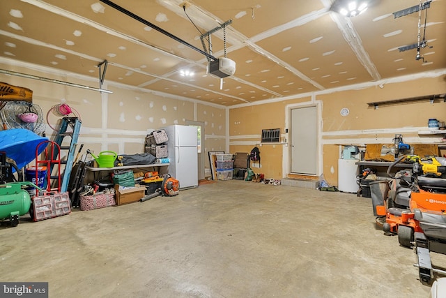 27073 Carrie Ct, Mechanicsville, MD 20659 - garage with freestanding refrigerator and a garage door opener