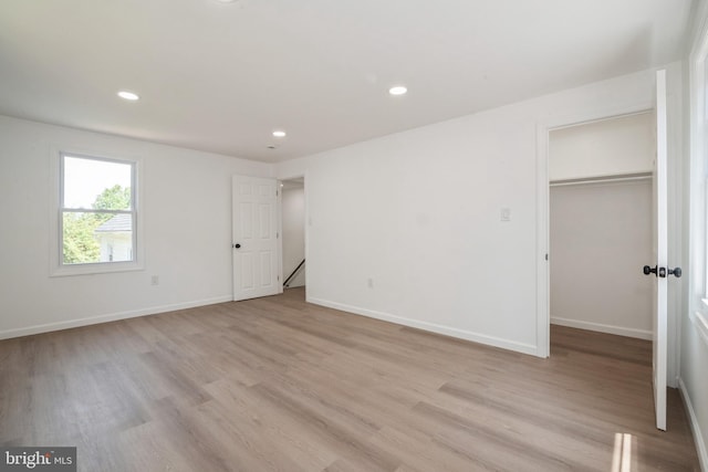 2400 Maurice St, Port Norris, NJ 08349 - unfurnished bedroom featuring light wood finished floors, a spacious closet, recessed lighting, baseboards, and a closet
