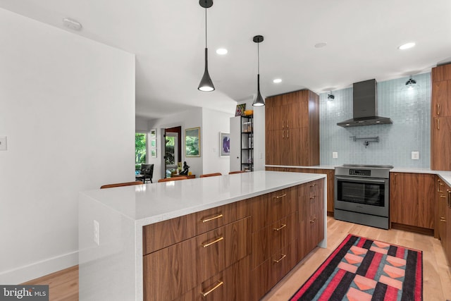 11111 Willow Bottom Dr, Columbia, MD 21044 - kitchen with wall chimney exhaust hood, stainless steel electric stove, modern cabinets, brown cabinetry, and a kitchen island