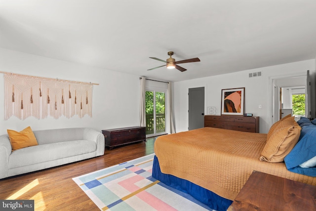 11111 Willow Bottom Dr, Columbia, MD 21044 - bedroom featuring access to exterior, wood finished floors, and ceiling fan