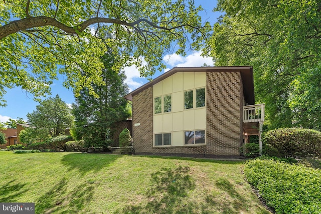 11111 Willow Bottom Dr, Columbia, MD 21044 - view of home's exterior featuring brick siding and a lawn