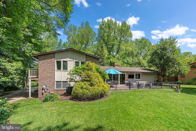 11111 Willow Bottom Dr, Columbia, MD 21044 - rear view of property featuring brick siding, a patio area, board and batten siding, and central air condition unit