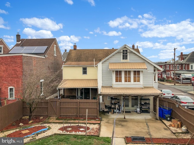 3 Third St, Pottstown, PA 19464 - back of house with a fenced backyard, a patio area, a gate, and a chimney