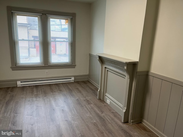 3 Third St, Pottstown, PA 19464 - unfurnished dining area featuring a baseboard heating unit and light wood finished floors
