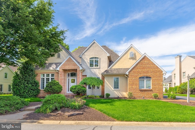 826 Bent Creek Dr, Lititz, PA 17543 - traditional-style home with stucco siding, a front lawn, and brick siding