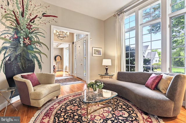 826 Bent Creek Dr, Lititz, PA 17543 - living area featuring wood finished floors, a chandelier, and baseboards
