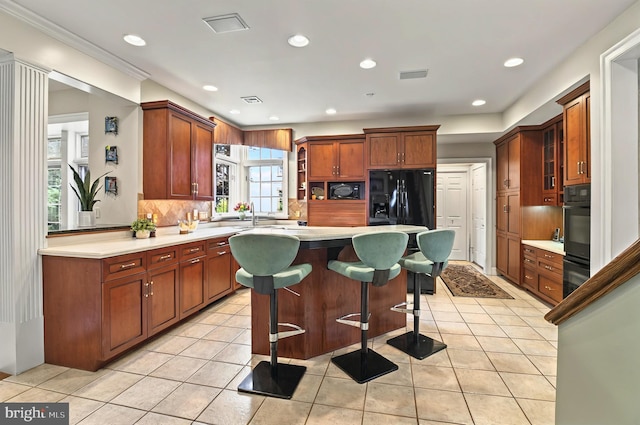 826 Bent Creek Dr, Lititz, PA 17543 - kitchen with a breakfast bar area, tasteful backsplash, a kitchen island, light tile patterned floors, and recessed lighting