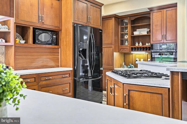 826 Bent Creek Dr, Lititz, PA 17543 - kitchen with black appliances, open shelves, light countertops, and brown cabinetry