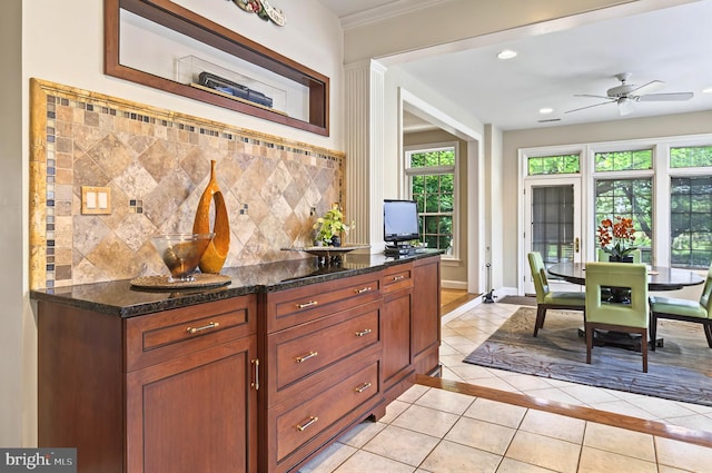 826 Bent Creek Dr, Lititz, PA 17543 - kitchen with light tile patterned floors, plenty of natural light, ceiling fan, dark stone counters, and recessed lighting