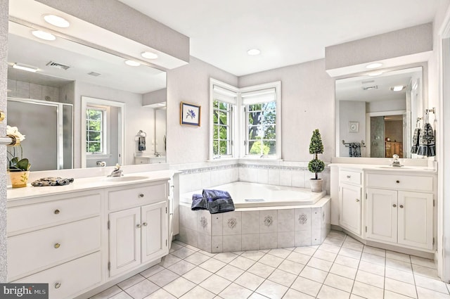 826 Bent Creek Dr, Lititz, PA 17543 - bathroom with tile patterned floors, a shower stall, two vanities, a garden tub, and plenty of natural light