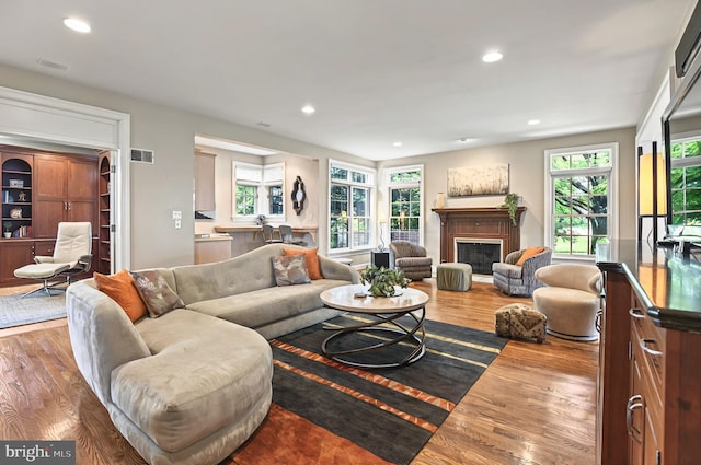 826 Bent Creek Dr, Lititz, PA 17543 - living room featuring wood finished floors, recessed lighting, and a fireplace