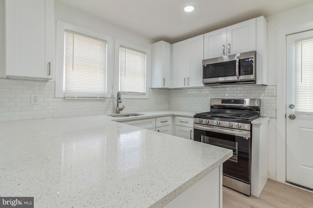 395 Main St, Cedarville, NJ 08311 - kitchen with appliances with stainless steel finishes, a sink, white cabinetry, and recessed lighting