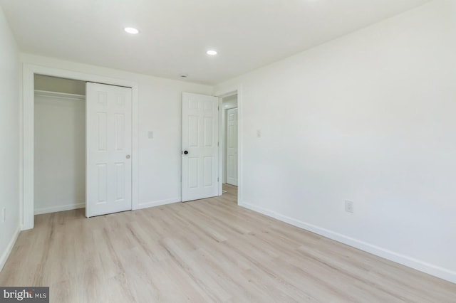 395 Main St, Cedarville, NJ 08311 - unfurnished bedroom featuring light wood-type flooring, baseboards, recessed lighting, and a closet