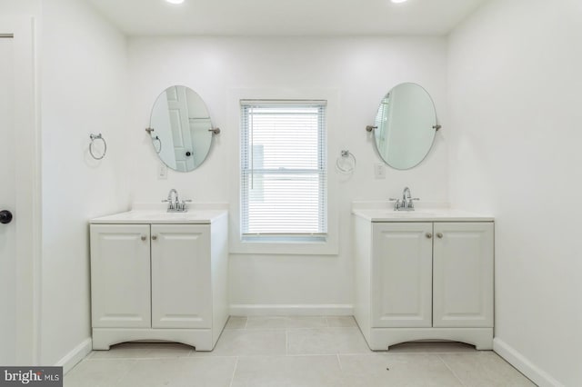 395 Main St, Cedarville, NJ 08311 - full bath featuring tile patterned floors, baseboards, and two vanities