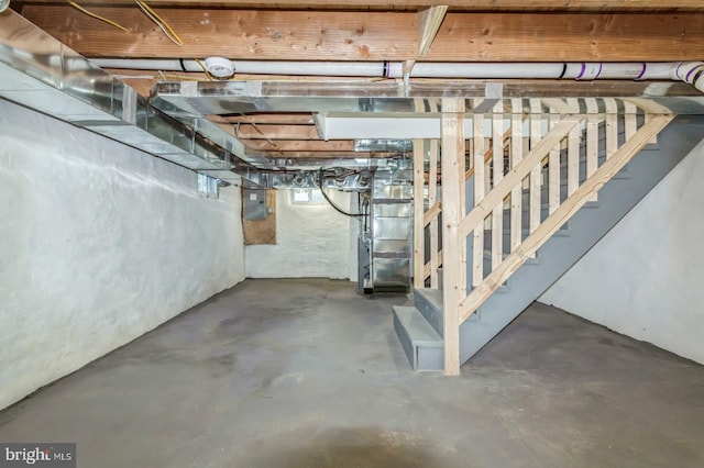 395 Main St, Cedarville, NJ 08311 - basement featuring electric panel, stairway, and heating unit