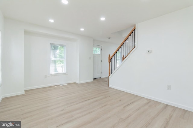 395 Main St, Cedarville, NJ 08311 - unfurnished living room featuring stairway, light wood-style flooring, recessed lighting, and baseboards