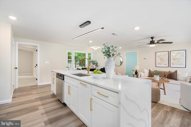 214 Kennard Ave, Edgewood, MD 21040 - kitchen featuring dishwasher, a sink, open floor plan, white cabinetry, and light wood-style floors