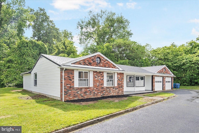 214 Kennard Ave, Edgewood, MD 21040 - single story home featuring an attached garage, brick siding, asphalt driveway, a front yard, and roof with shingles