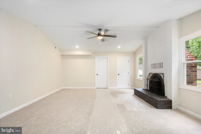 214 Kennard Ave, Edgewood, MD 21040 - unfurnished living room featuring light colored carpet, ceiling fan, plenty of natural light, a fireplace, and recessed lighting