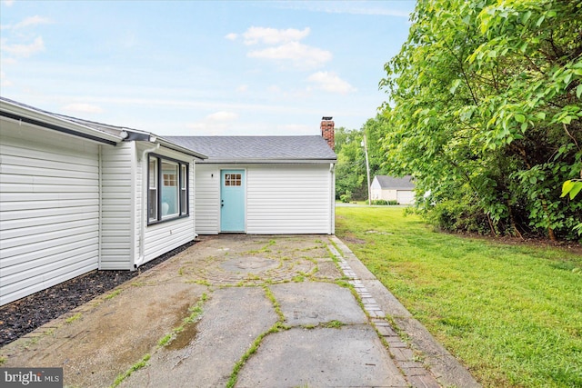 214 Kennard Ave, Edgewood, MD 21040 - rear view of property with a lawn, a chimney, and a patio area