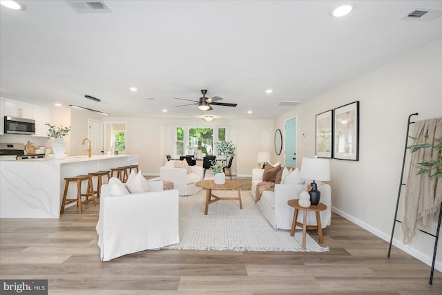 214 Kennard Ave, Edgewood, MD 21040 - living room with recessed lighting, a ceiling fan, light wood-style floors, and baseboards