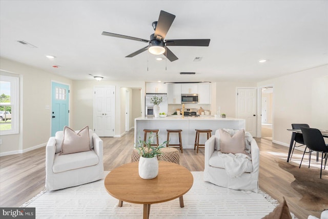 214 Kennard Ave, Edgewood, MD 21040 - living room with light wood finished floors, recessed lighting, baseboards, and a ceiling fan
