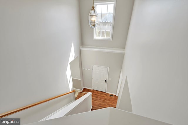 82 Grayson Ave, East Earl, PA 17519 - staircase with a chandelier, wood finished floors, and baseboards