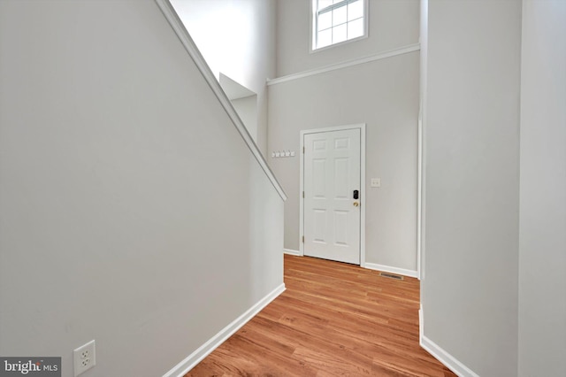 82 Grayson Ave, East Earl, PA 17519 - foyer entrance featuring light wood-style floors, baseboards, stairs, and a towering ceiling