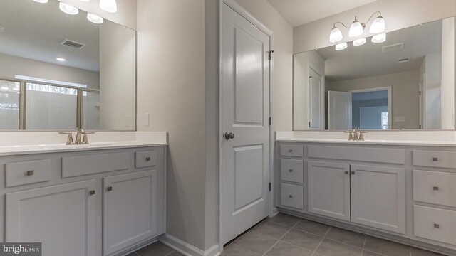 139 Erica Ln, Columbia, PA 17512 - full bath with tile patterned floors, two vanities, baseboards, and a stall shower
