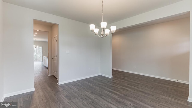 139 Erica Ln, Columbia, PA 17512 - unfurnished room featuring a chandelier, dark wood finished floors, and baseboards